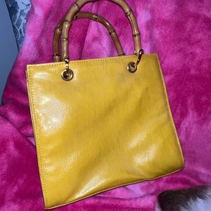 Spring/summer beautiful yellow hand bag with bamboo handles.